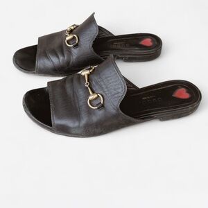 Gucci Black Leather Mules with Gold Accents